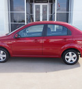 chevrolet aveo 2011 red sedan lt 4 cylinders automatic with overdrive 77802