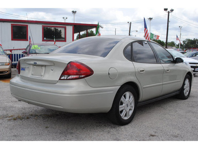 ford taurus 2005 lt  green sedan sel 6 cylinders automatic with overdrive 77020