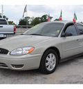 ford taurus 2005 lt  green sedan sel 6 cylinders automatic with overdrive 77020
