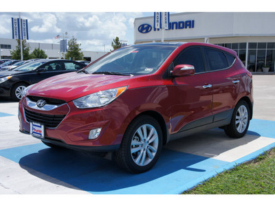 hyundai tucson 2012 dk  red limited gasoline 4 cylinders front wheel drive automatic 77094