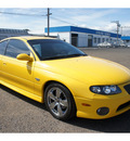 pontiac gto 2004 yellow coupe gasoline 8 cylinders rear wheel drive automatic 98632
