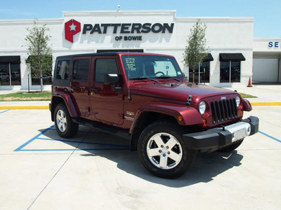 jeep wrangler unlimited 2009 red suv sahara gasoline 6 cylinders 4 wheel drive automatic 76230