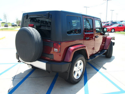 jeep wrangler unlimited 2009 red suv sahara gasoline 6 cylinders 4 wheel drive automatic 76230