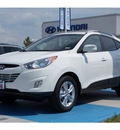 hyundai tucson 2013 cotton white suv gasoline 4 cylinders front wheel drive automatic 77094