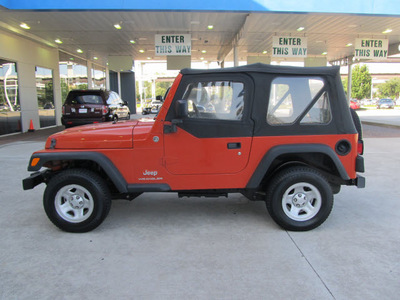 jeep wrangler 2006 orange suv se gasoline 4 cylinders 4 wheel drive 6 speed manual 77471