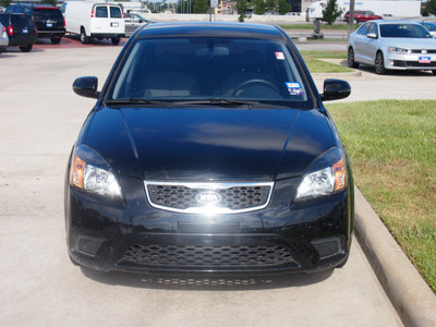 kia rio 2011 black sedan gasoline 4 cylinders front wheel drive automatic 77090