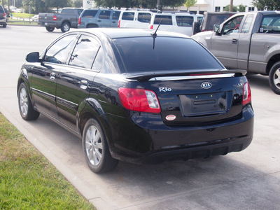 kia rio 2011 black sedan gasoline 4 cylinders front wheel drive automatic 77090