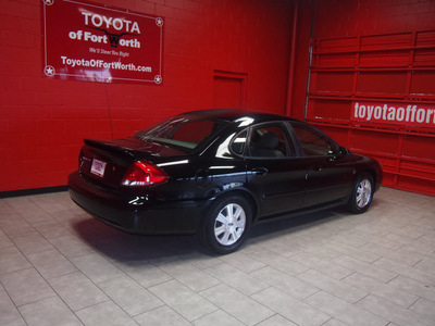 ford taurus 2005 black sedan sel gasoline 6 cylinders front wheel drive automatic with overdrive 76116