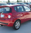 chevrolet aveo 2009 red hatchback aveo5 lt gasoline 4 cylinders front wheel drive automatic 77304