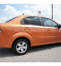 chevrolet aveo 2007 orange sedan ls gasoline 4 cylinders front wheel drive automatic 76543