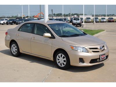toyota corolla 2011 tan sedan le gasoline 4 cylinders front wheel drive automatic with overdrive 77469