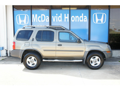 nissan xterra 2002 gold suv gasoline 6 cylinders rear wheel drive automatic 77034