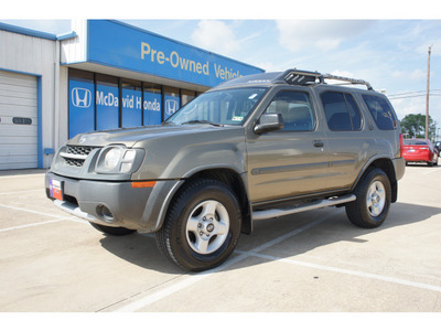 nissan xterra 2002 gold suv gasoline 6 cylinders rear wheel drive automatic 77034