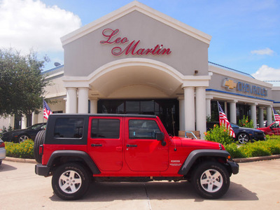 jeep wrangler unlimited 2010 red suv sport gasoline 6 cylinders 4 wheel drive automatic 77566