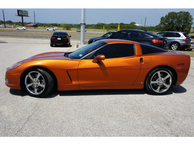 chevrolet corvette 2009 orange coupe gasoline 8 cylinders rear wheel drive 6 speed manual 76505