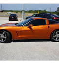 chevrolet corvette 2009 orange coupe gasoline 8 cylinders rear wheel drive 6 speed manual 76505