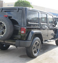 jeep wrangler unlimited 2012 black suv sahara gasoline 6 cylinders 4 wheel drive automatic with overdrive 77099
