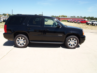 gmc yukon 2012 black suv slt flex fuel 8 cylinders 2 wheel drive automatic with overdrive 76567