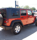 jeep wrangler unlimited 2009 orange suv x gasoline 6 cylinders 2 wheel drive automatic 77864
