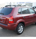 hyundai tucson 2009 dk  red suv gasoline 4 cylinders front wheel drive automatic 78501