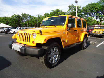 jeep wrangler 2012 orange suv unlimited sahara gasoline 6 cylinders 4 wheel drive automatic 33157