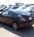 scion tc 2009 dk  red coupe base gasoline 4 cylinders front wheel drive 5 speed manual 76053