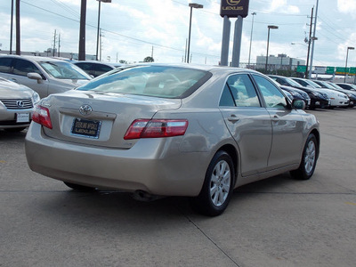 toyota camry 2007 tan sedan xle gasoline 4 cylinders front wheel drive automatic with overdrive 77074