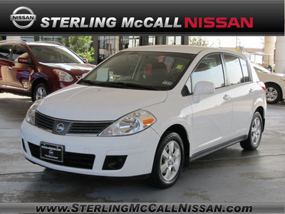 nissan versa 2009 white hatchback 1 8 sl gasoline 4 cylinders front wheel drive automatic with overdrive 77477