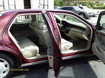 cadillac deville 2000 red sedan gasoline 8 cylinders front wheel drive automatic 77565