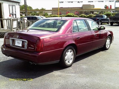 cadillac deville 2000 red sedan gasoline 8 cylinders front wheel drive automatic 77565