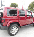jeep wrangler unlimited 2013 red suv sahara gasoline 6 cylinders 4 wheel drive automatic 34731