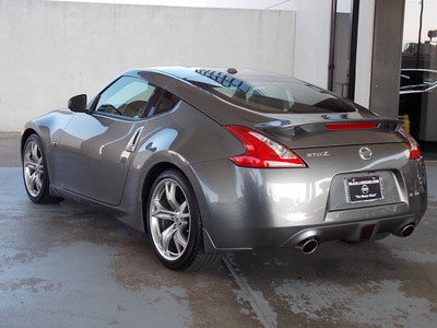 nissan 370z 2011 silver coupe touring gasoline 6 cylinders rear wheel drive 6 speed manual 77477