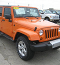 jeep wrangler unlimited 2013 orange suv sahara gasoline 6 cylinders 4 wheel drive 5 speed automatic 62863