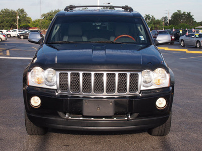 jeep grand cherokee 2006 black suv overland gasoline 8 cylinders 4 wheel drive automatic 33021
