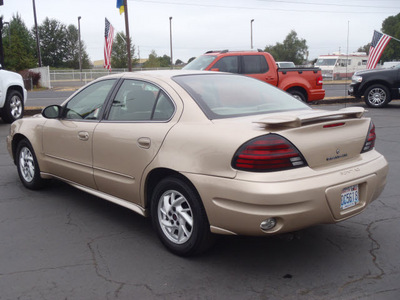 pontiac grand am 2003 beige sedan se1 gasoline 6 cylinders front wheel drive automatic 98632