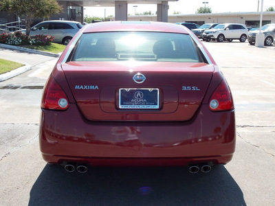 nissan maxima 2004 dk  red sedan 3 5 sl gasoline 6 cylinders front wheel drive shiftable automatic 77074