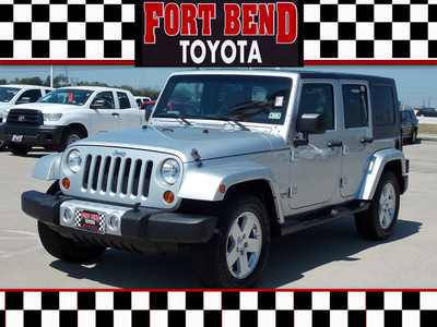 jeep wrangler unlimited 2010 silver suv sahara gasoline 6 cylinders 2 wheel drive automatic with overdrive 77469