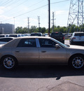 cadillac deville 2005 beige sedan dts gasoline 8 cylinders front wheel drive automatic 77074