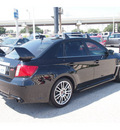 subaru impreza wrx 2011 black sedan sti gasoline 4 cylinders all whee drive 6 speed manual 77074