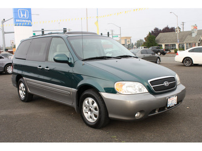 kia sedona 2005 green van ex gasoline 6 cylinders front wheel drive automatic 98632