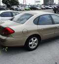 ford taurus 2003 beige sedan ses gasoline 6 cylinders front wheel drive automatic 75062
