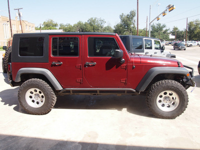 jeep wrangler unlimited 2010 red suv sport gasoline 6 cylinders 4 wheel drive automatic 76520