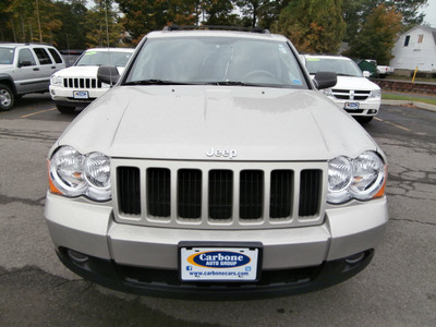 jeep grand cherokee 2010 tan suv laredo gasoline 6 cylinders 4 wheel drive automatic 13502