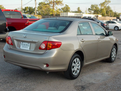 toyota corolla 2010 tan sedan le gasoline 4 cylinders front wheel drive automatic with overdrive 77074