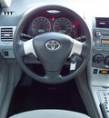 toyota corolla 2011 white sedan le 4 cylinders automatic with overdrive 77074