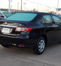 toyota corolla 2011 black sedan le 4 cylinders automatic with overdrive 77074
