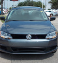 volkswagen jetta 2011 gray sedan 4 cylinders shiftable automatic 77074