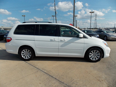 honda odyssey 2006 white van touring gasoline 6 cylinders front wheel drive automatic with overdrive 77074