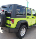 jeep wrangler unlimited 2013 green suv sport gasoline 6 cylinders 4 wheel drive automatic 77388