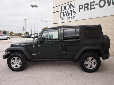 jeep wrangler unlimited 2012 green suv rubicon gasoline 6 cylinders 4 wheel drive 6 speed manual 76011